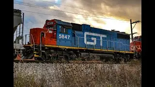 CN 8855 leads CN M337 with 8 units including a GTW and an ex CREX in Glendale Heights, IL on 12/4/24