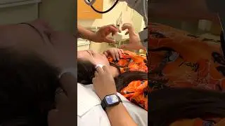 Trying to do a steroid ear injection, but patient had other ideas! 