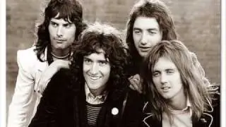 Queen In The Lap Of The Gods Revisited