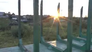 Вид из окна поезда. Закат в деревне