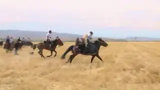 Life in Xinjiang 4   : Scrambling for a sheep is a traditional game of the brave Kazaks.