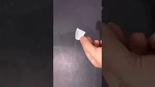 Make a needle threader from string and cans