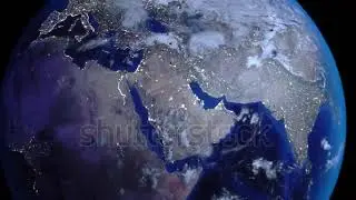 Zoom out of the Middle East through clouds to see the Earth from space.