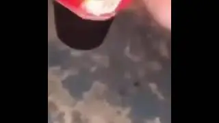 guy lights up fire cracker in a yogurt container