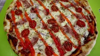 Pizza with bacon and cherry tomatoes