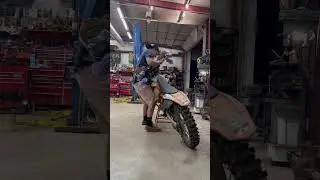 Guy tries to ride dirtbike. 
