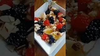 SOAKED OVERNIGHT IRISH OATS WITH FRESH FRUITS, SLIVERED ALMONDS, AND HONEY.