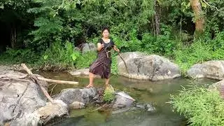 Primitive technology - killing a big cat fish by a girl at river