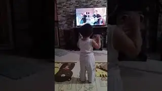 Eliam dancing to the Hokey pokey