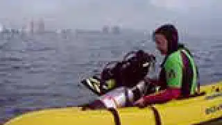Chris pulling tank into kayak - old, low quality video from 2004
