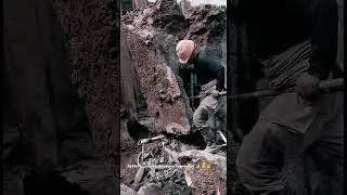 Hardworking worker splitting big concrete pile foundation