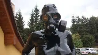 Latex catsuit and British gas mask