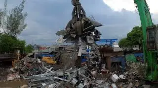 loading a scrap container in miami