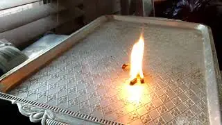 Burning Belarussian cheese from Auchan supermarket in Saint-Petersburg, Russia