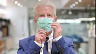 senior old businessman wearing protective face mas XME2BHD