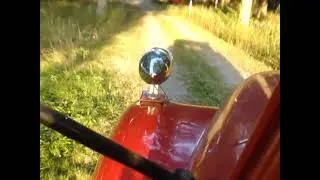 nifty 50 chevy in cab driving with the sireeeen on.