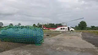 helicopter mengangkat tandon seberat 1/2 ton...bell 212 es