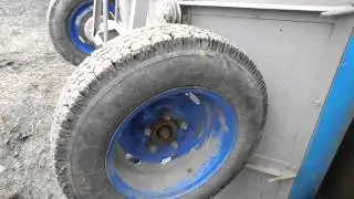 MTZ walk-behind tractor. Replacement of standard trailer wheels.
