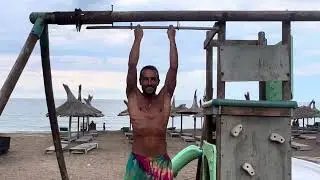 Daniel shows his strength on the beach in Romania
