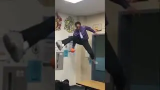 Teacher dunks low-rim in classroom 
