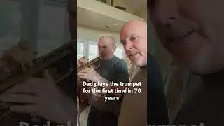 Dad plays the trumpet during an AARP photo shoot