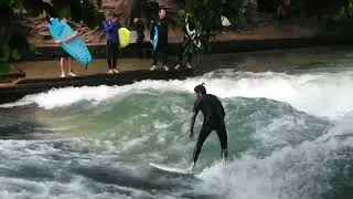 Surfing at the English Garden Bridge in Munich