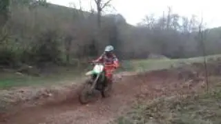 2002 KX125 vs 1990 CR125 doing burms/corners and small jump
