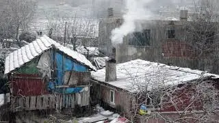 Smoke coming out of chimney during snow