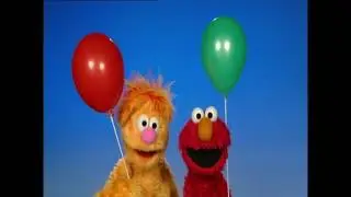 Ollie and Elmo Sharing a Balloon