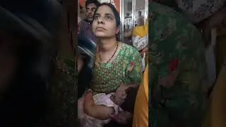 Indian village girl breastfeeding her baby 