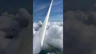 Airplane Flying Above Clouds