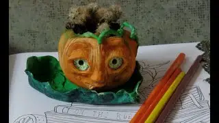 Planter for flowers made of clay. Getting ready for Halloween.
