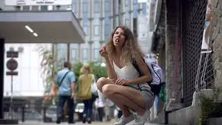 Girl eating on the street in Japan