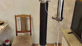 What should be the water temperature at the outlet of the dephlegmator?
