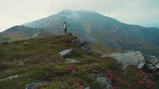 Girl walks down the mountains