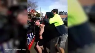 Tradies come to rescue of officer after man begins choking him
