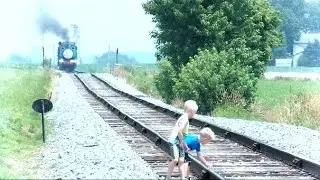 Children On Train Tracks While Train Is Approaching