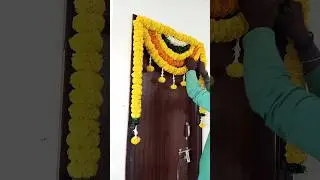 Marigold mango leaves flowers Entrance door window hall balcony gate house warming flower decoration