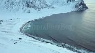 Stock Video - Aerial view of Unstad surf beach in Norway during winter