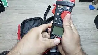 Aneng ST181 digital clamp-on multimeter.