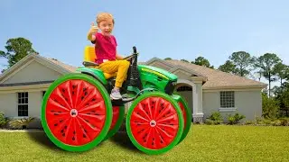 Leo's tractor wheels fell off, Dad helped and put big watermelon wheels on the tractor