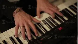 Hand playing on digital piano. Close-up. Small depth of field. Black and white