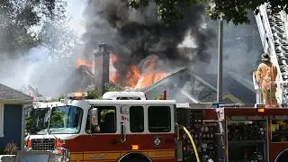 Fully involved house fire in Burlington, Ontario threatens other home