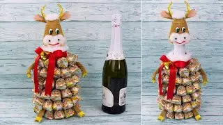 Idea: Symbol of 2021 on champagne. Bull made of champagne and sweets. Do-it-yourself bull