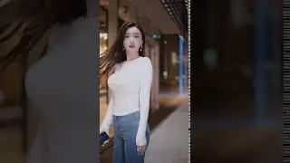 Pretty girl in tight jeans walking on the street 