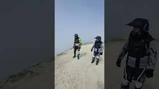 Над облаками, стоя на земле.