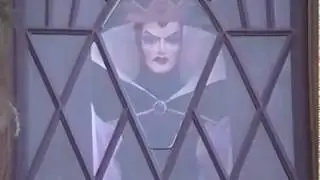 Evil Queen in window over Snow Whites Scary Adventures Disneyland