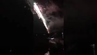Crazy guy holds onto Roman Candle Minigun!