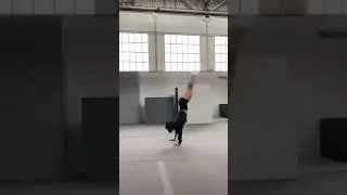 A teenage girl doing gymnastics Back Flipping 