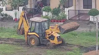 JCB carrying on Sand